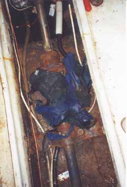 Photo 4 - Remnant's of the owner/operator's rain pants entangled in the shaft coupling and shaft.