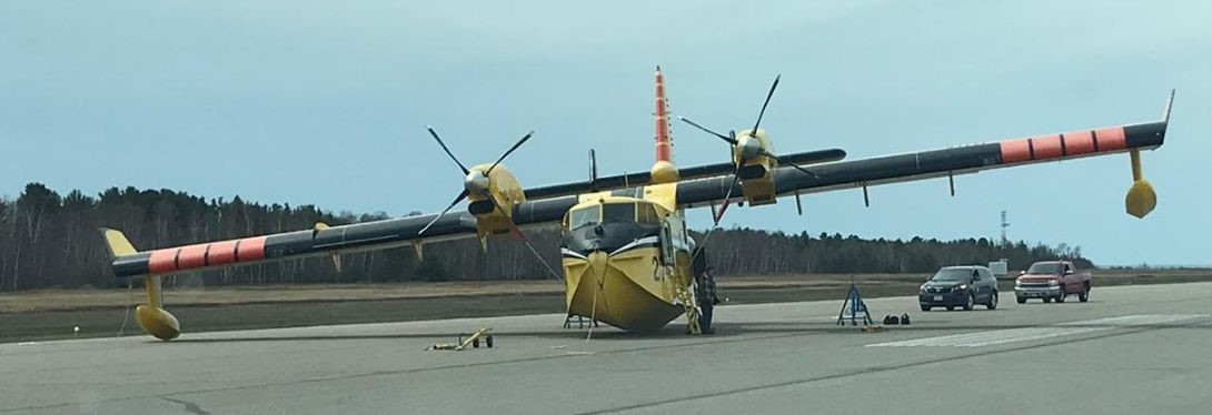 Photo of the occurrence aircraft after the gear-up landing (Source: Province of Ontario, Ministry of Northern Development, Mines, Natural Resources and Forestry)