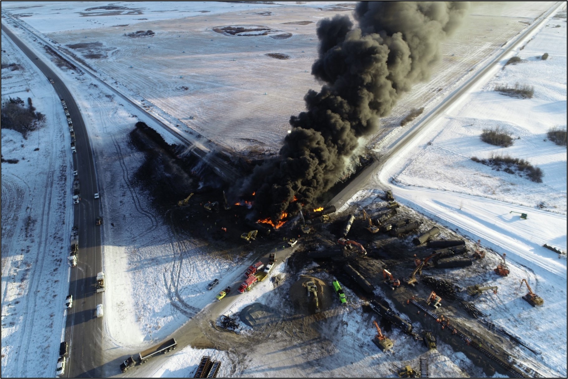 Aerial photo of the derailment site and pool fire, looking east, taken on 09 December 2022 (Source: Canadian Pacific)